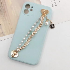 Light blue iPhone case with gold heart clasp, pearl chain and camellia flower charm
