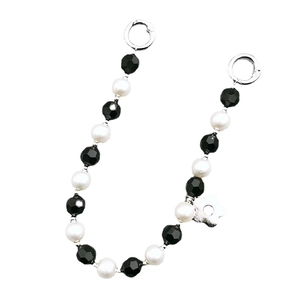 Handmade black acrylic beads and pearl chain with a silver flower charm and ring clasps