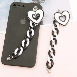 Acrylic chain phone charm with heart pendants and metal hook on a pink background