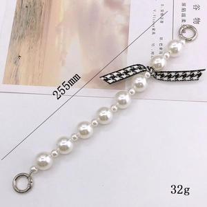 Handmade pearl beaded phone strap with houndstooth bow and silver metal spring rings