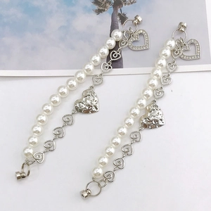 Pearl heart chain accessory with silver layered chains and hollow heart pendants