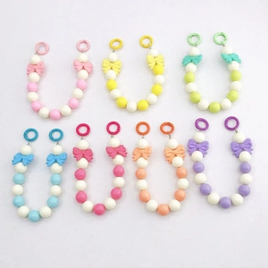 Pendentifs de sac en perles acryliques avec nœuds macarons et fermoirs à ressort