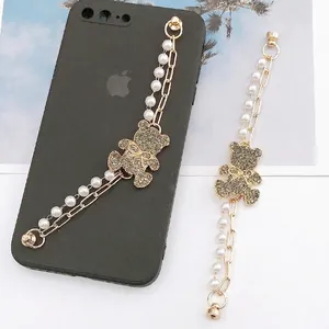 Sparkly bear phone charm with white faux pearls and gold chain links for smart phones