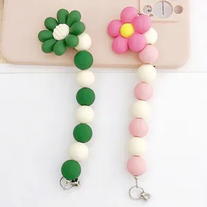 Chic matte sunflower beaded phone charms in green and pink colors with metal clasps