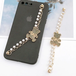 Luxury pearl phone chain strap featuring a sparkling crystal rhinestone bear pendant charm
