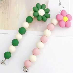 Floral beaded phone charms in green and pink matte finishes with silver lobster clasps