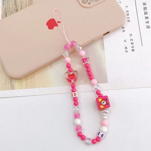 Pink acrylic heart beaded phone strap with colorful charms on a mobile case