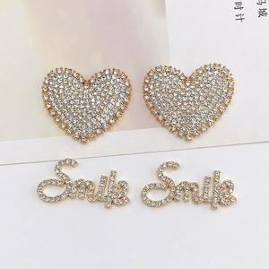 Golden heart and Smile letter stud earrings set with sparkling zircon stones