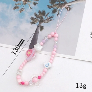 Handmade beaded phone strap with pink Macaron beads, white shells, and cute planet charms