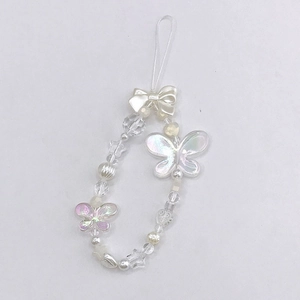 Detail of sweet butterfly beaded phone strap with iridescent white stars and hearts charms