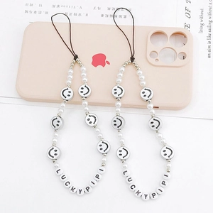 Short beaded phone lanyard with pearls, smiley faces and Lucky Pipi letter charms