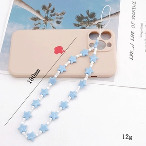 Blue star beaded phone charm strap with white pearls on a minimalist phone case