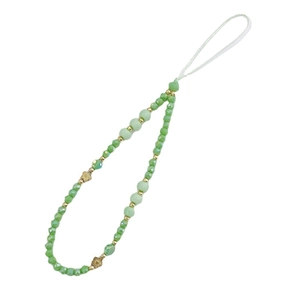 Handmade beaded phone strap with green crystal beads and gold flower spacers on white background