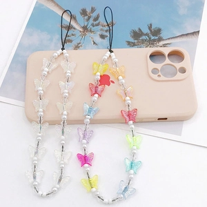 Handmade butterfly pearl phone charms in colorful and white beads on a pink case