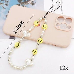 Beaded phone strap with white pearls, yellow smile face, and heart charms 150mm length