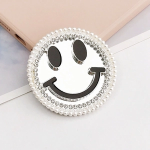 Smiley face phone grip with mirror surface and elegant pearl and rhinestone decoration