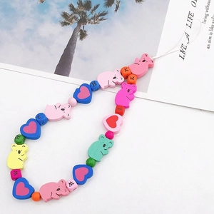Colorful beaded phone strap with wooden bear and heart beads on summer beach card