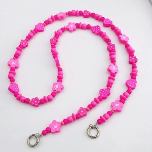 Pink wooden bead phone charm strap featuring floral and heart motifs with silver ring clasp