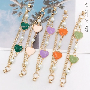 Golden heart charm bracelet with faux pearls and enamel pendants in five summer colors