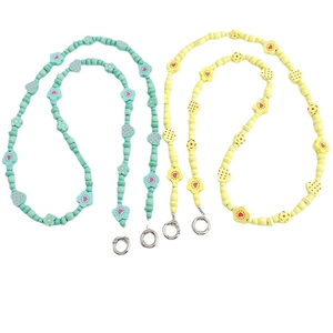 Floral wooden bead phone charms in mint green and yellow with heart patterns