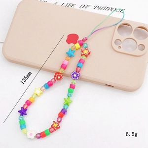Colorful handmade LOVE beaded phone charm with stars and butterflies on a beige case