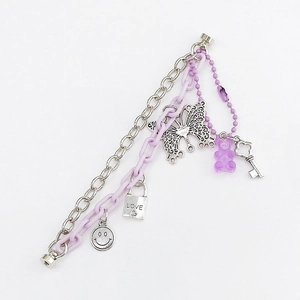 Candy colored multi-layer chain accessory with purple gummy bear and metal charms