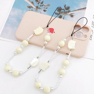 Chic cream-colored beaded phone lanyard with cute cat head and pumpkin bead charms