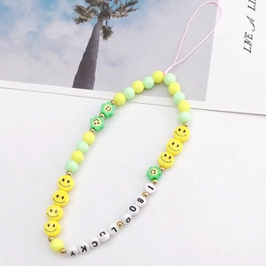 Handmade yellow and mint green acrylic smile face beaded phone lanyard with LUCKY letter beads