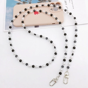 Beaded crossbody phone strap with black and white smiley face beads and metal lobster clasps