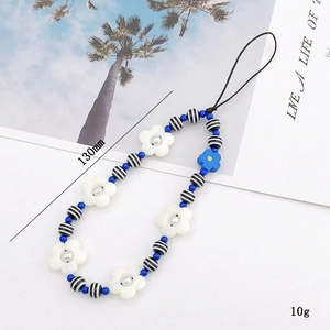 Colorful handmade beaded phone strap with blue floral charms and wrist lanyard
