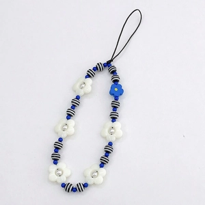 Detailed close-up of blue sunflower and acrylic floral beads on phone charm strap