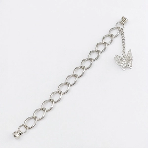 Detailed shot of silver double-layered metal chain with hollow butterfly pendant