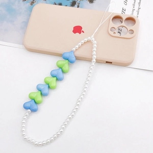 Detail of beaded heart phone strap with blue and green acrylic charms on a white cord