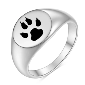 Polished silver signet ring with engraved paw print design shown from a 45-degree angle