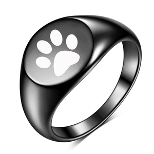 Polished black signet ring featuring a laser engraved white pet paw print on a flat top