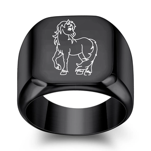 Macro detail of a 18mm black stainless steel ring with a white laser-engraved horse icon