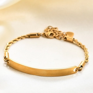 Golden stainless steel rope chain bracelet with a curved rectangle ID plate and lobster clasp