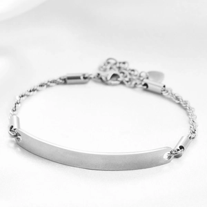 Close-up of polished silver stainless steel ID bar bracelet with lobster clasp and chain