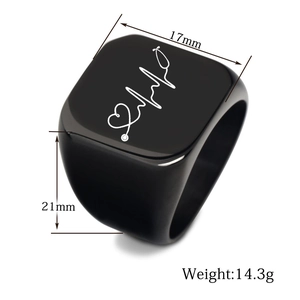 Macro detail of black signet ring with engraved heartbeat line showing 17mm width