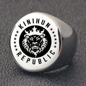 Macro shot of silver lion head signet ring featuring Kinihun Republic engraved text