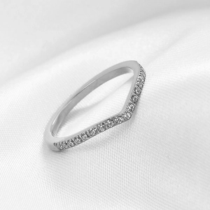 Detail showing V-shaped stainless steel ring with micro-pave crystals on silk