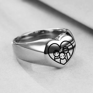Detailed view of silver heart signet ring with family line art engraving and high polish