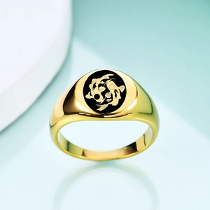Detail of 18K gold stainless steel ring featuring black round face with twin koi fish