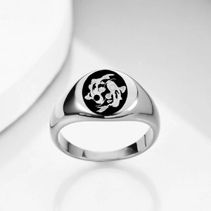 Macro shot of 12mm silver stainless steel signet ring with black koi fish yin yang design