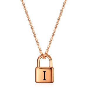 Detail of rose gold padlock pendant featuring engraved letter I on minimalist O-chain necklace
