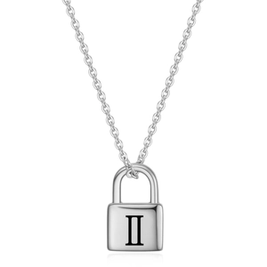 Macro view of padlock pendant with Roman numeral engraving on stainless steel chain