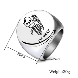 Macro detail of silver stainless steel signet ring with 22mm laser engraved skull face