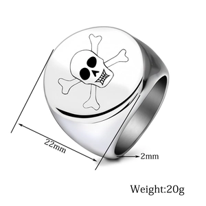 Macro detail of 22mm stainless steel signet ring featuring a laser skull design
