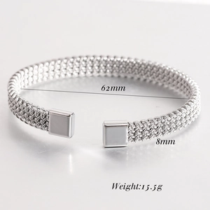 Detail of 8mm silver woven mesh open cuff bracelet with dimensions 62mm and 15.5g weight