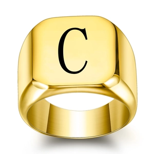 Polished gold signet ring with engraved letter C minimalist stainless steel jewelry